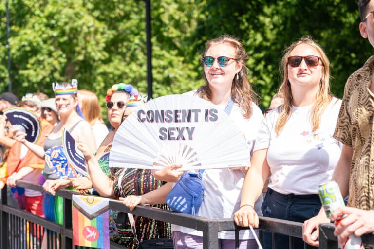 London Pride 2024 crowd with a sign that says consent is sexy