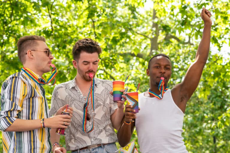 London Pride 2024 crowd cheering and blowing Elton John AIDS Foundation whistles